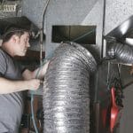 HVAC Expert working on ducts